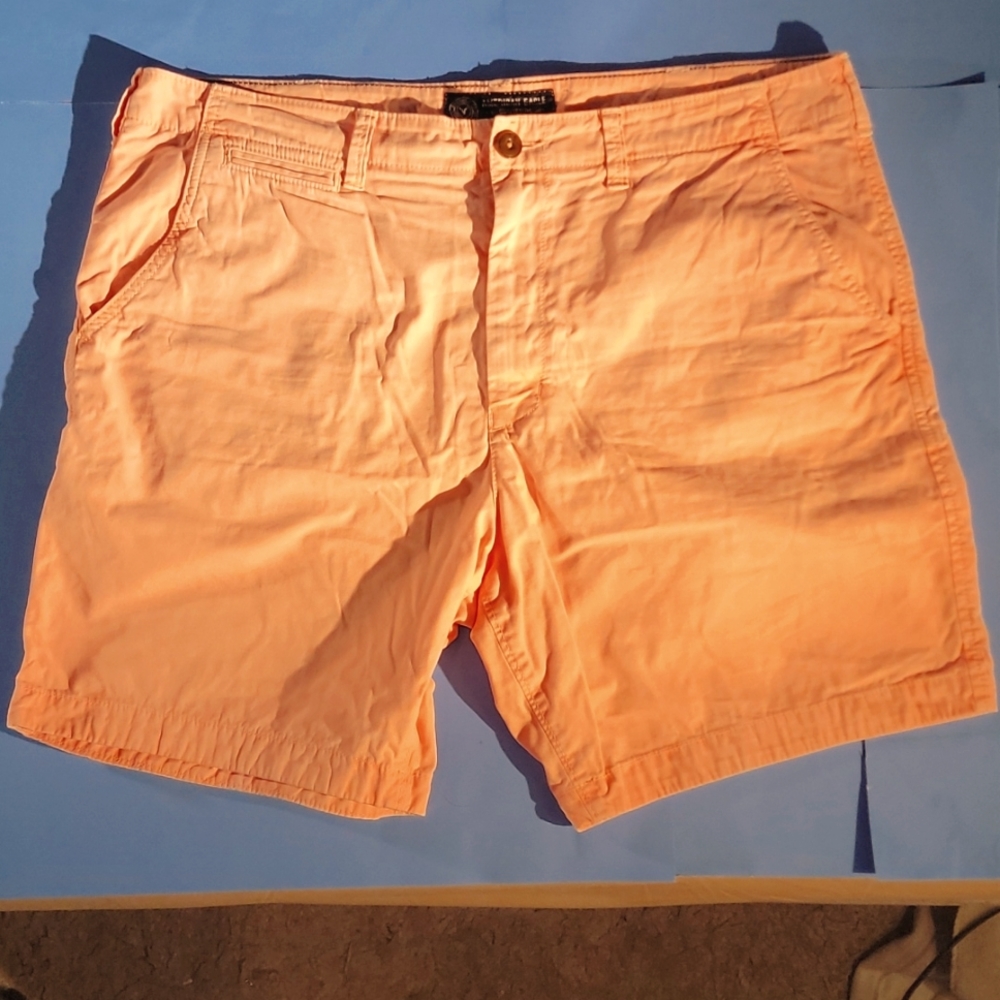 Faded fluorescent orange shorts